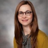 a simple headshot-style picture of Gwen Bradford, smiling