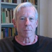 a headshot-style picture of Steve Crowell, with a bookshelf in the background